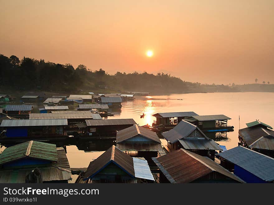 Sunset behide thai community in karnjanaburi