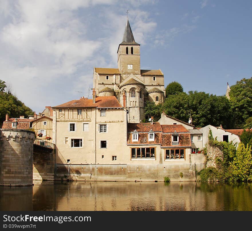 Medieval houses and Church on the banks of a river in Rural France. Medieval houses and Church on the banks of a river in Rural France