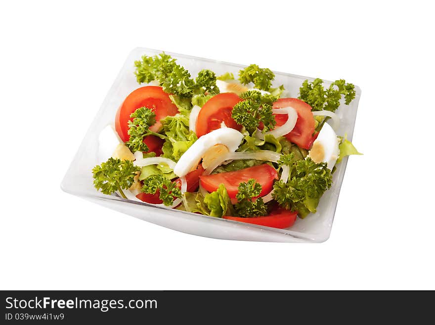 Salad of tomatoes, eggs and greens