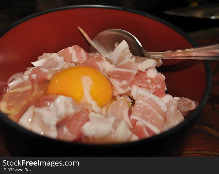 A closeup of a bowl of raw ingredients for making Okonomiyaki (Japanese cabbage pancake). A closeup of a bowl of raw ingredients for making Okonomiyaki (Japanese cabbage pancake).