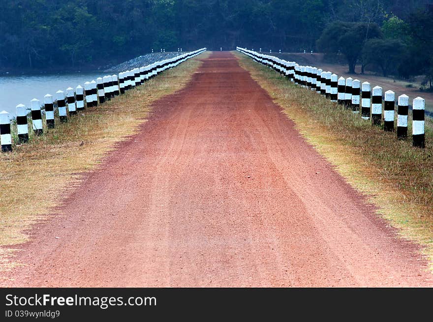 Rural road stretches through the reservoir. Rural road stretches through the reservoir.