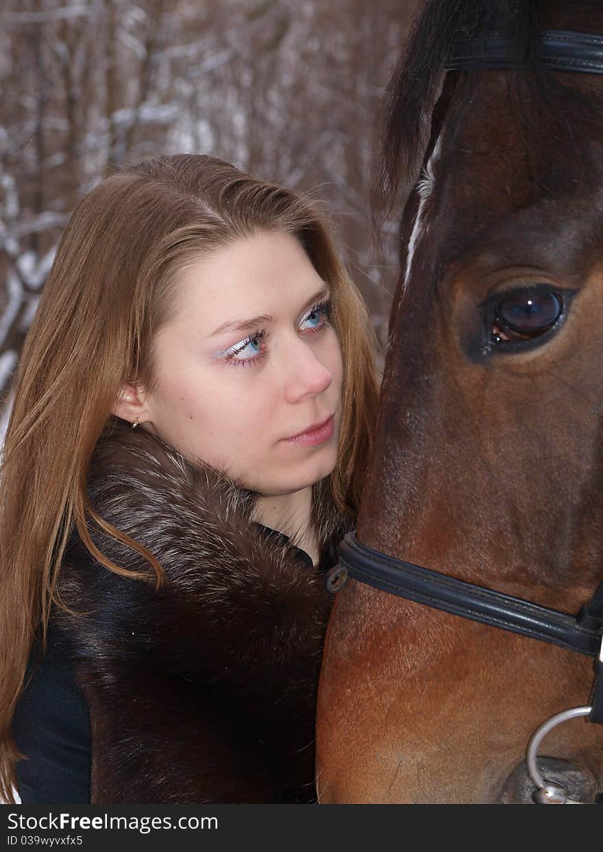 A girl and a horse for a walk in the park. A girl and a horse for a walk in the park