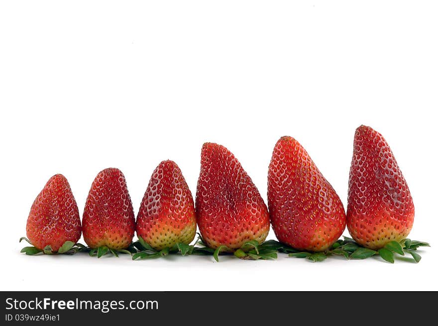 Fresh strawberries in a row on white background. Fresh strawberries in a row on white background