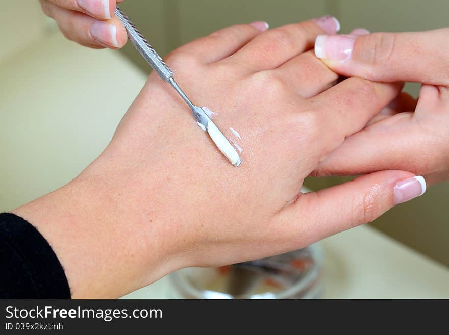 Fingernails manicure. Pro at work with her client.