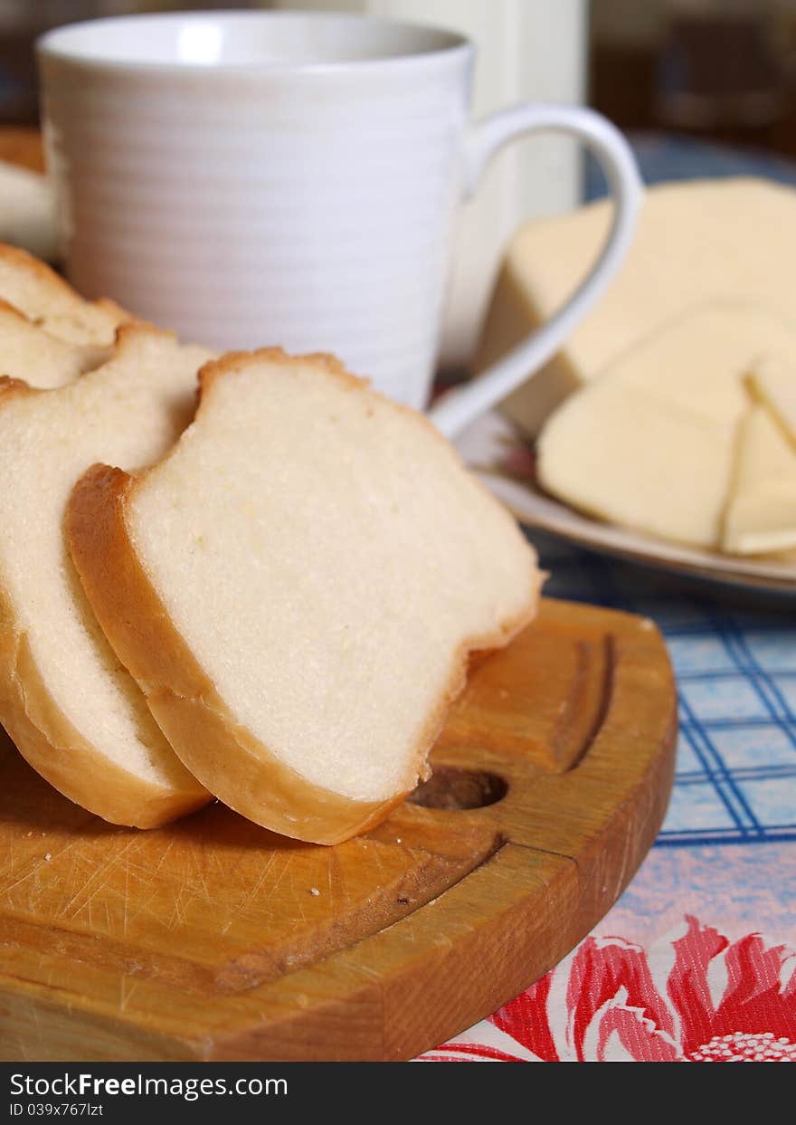 Milk in a mug and bread. Milk in a mug and bread