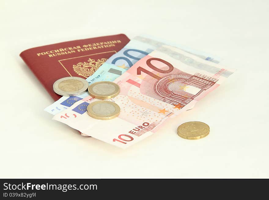 A Russian foreign passport with euro coins