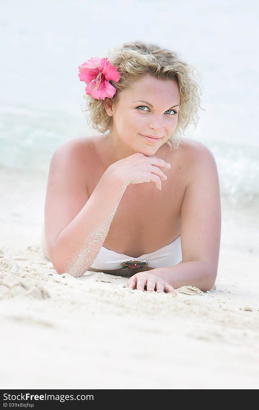 Young beautiful woman relaxing on natural background