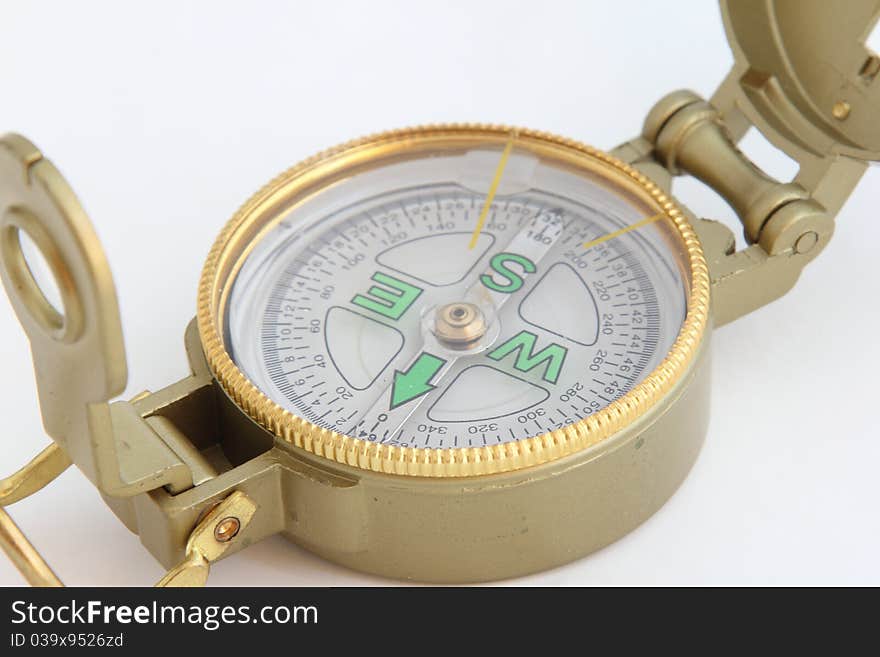 A tourist compass with a magnifying glass on white background