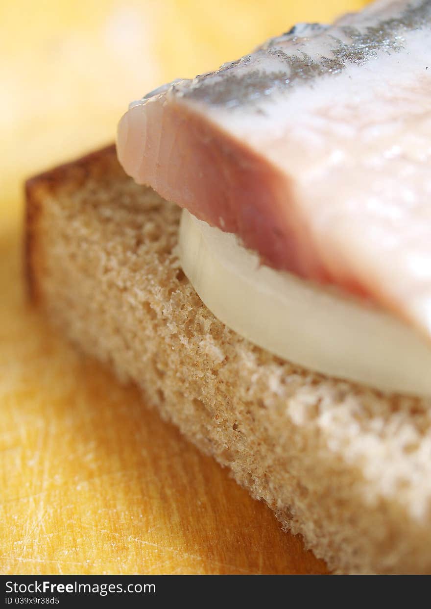 Salted fish, bread and onion closeup. Salted fish, bread and onion closeup