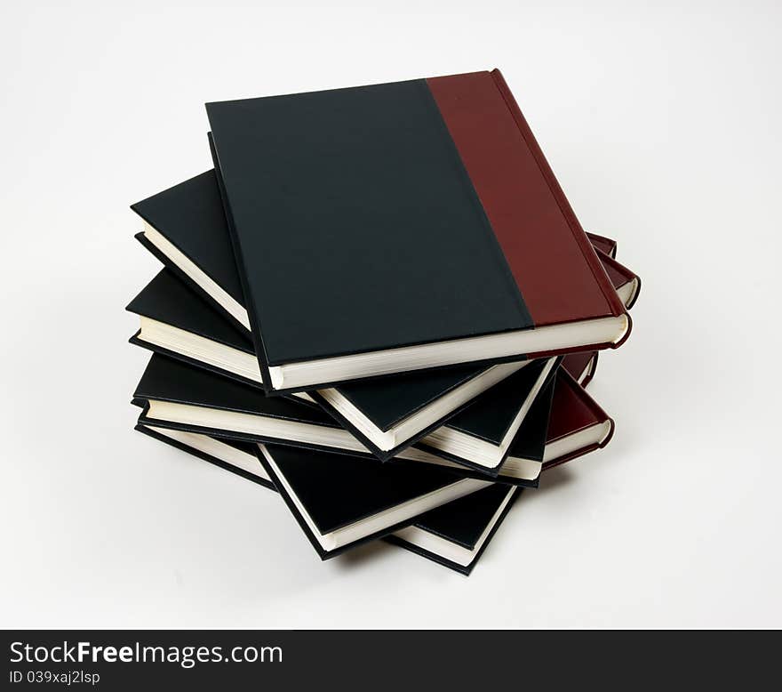 Close-up of encyclopedic volumes on white background. Close-up of encyclopedic volumes on white background