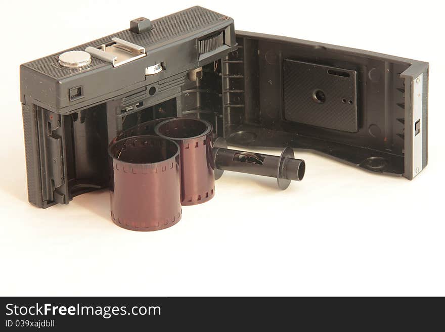 An old camera with open back with film