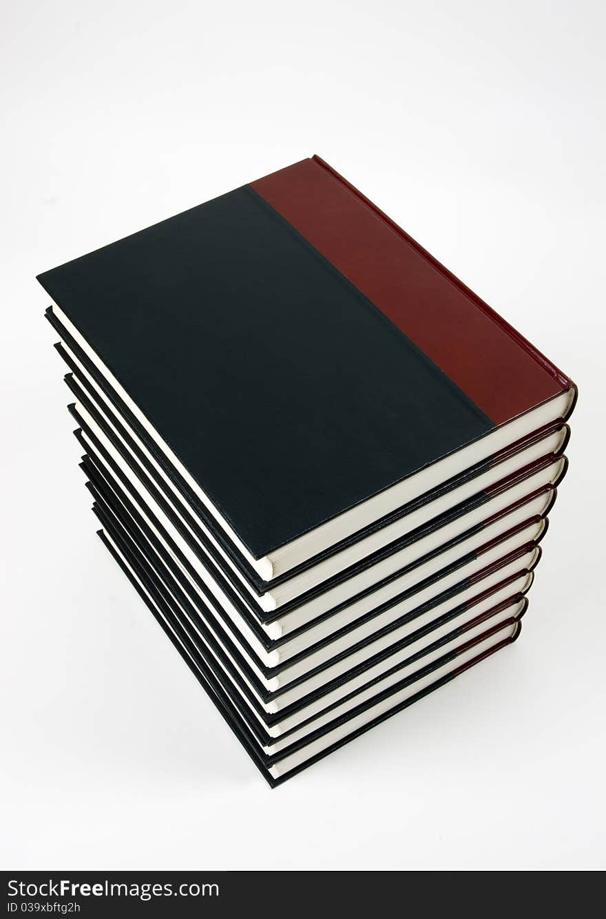 Close-up of encyclopedic volumes on white background. Close-up of encyclopedic volumes on white background