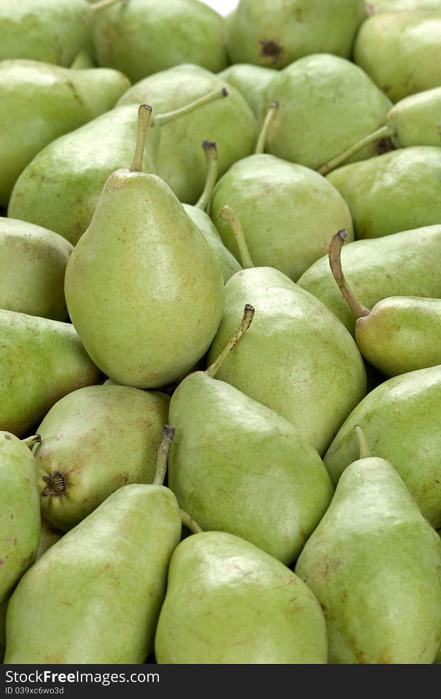 A vertical frame full of green pears