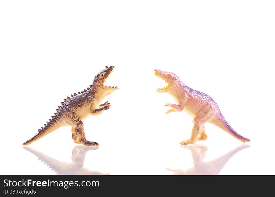 Toy Dinosaur T-Rex's Fighting Over White With Reflection