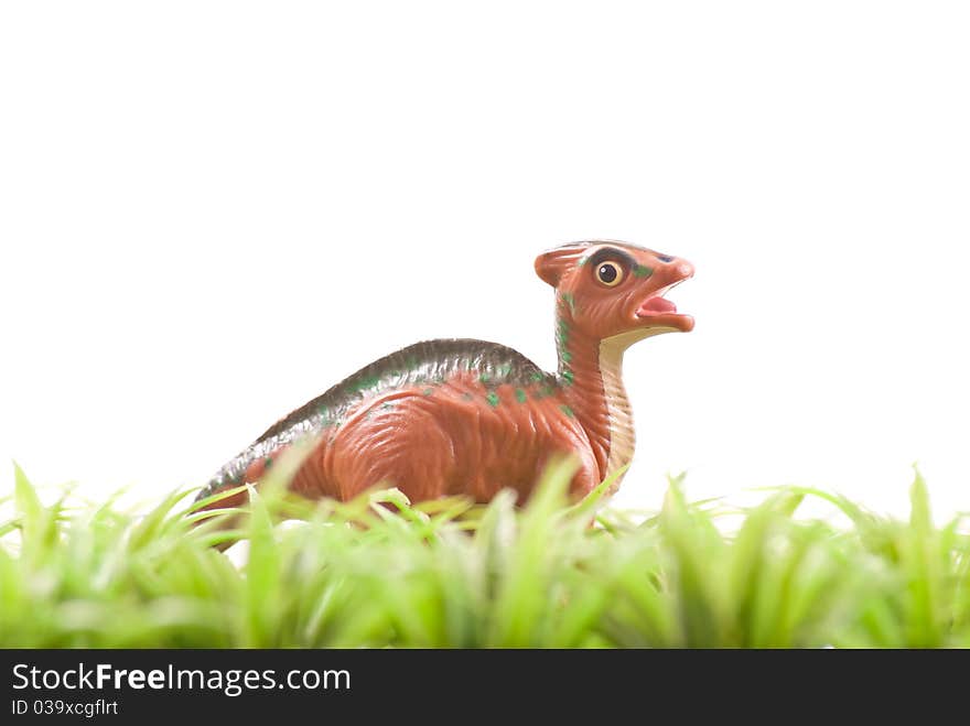 Toy Dinosaur In Grass