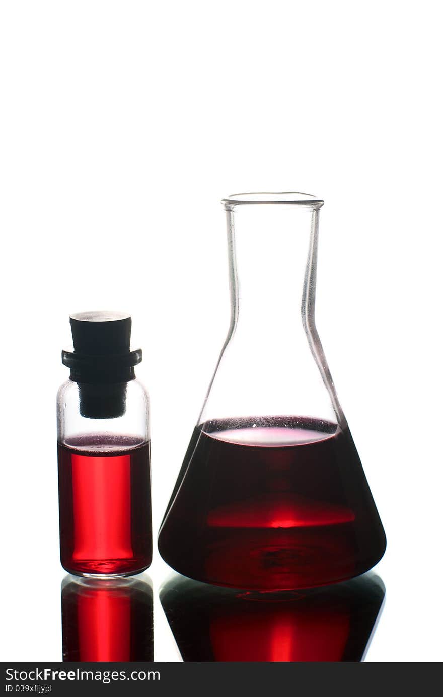 Lab flasks with red liquid. Lab flasks with red liquid.