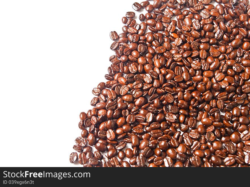 Many brown coffee beans on white background. Many brown coffee beans on white background