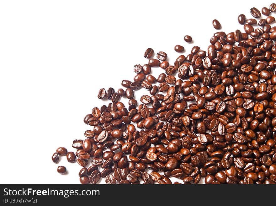 Many brown coffee beans on white background. Many brown coffee beans on white background