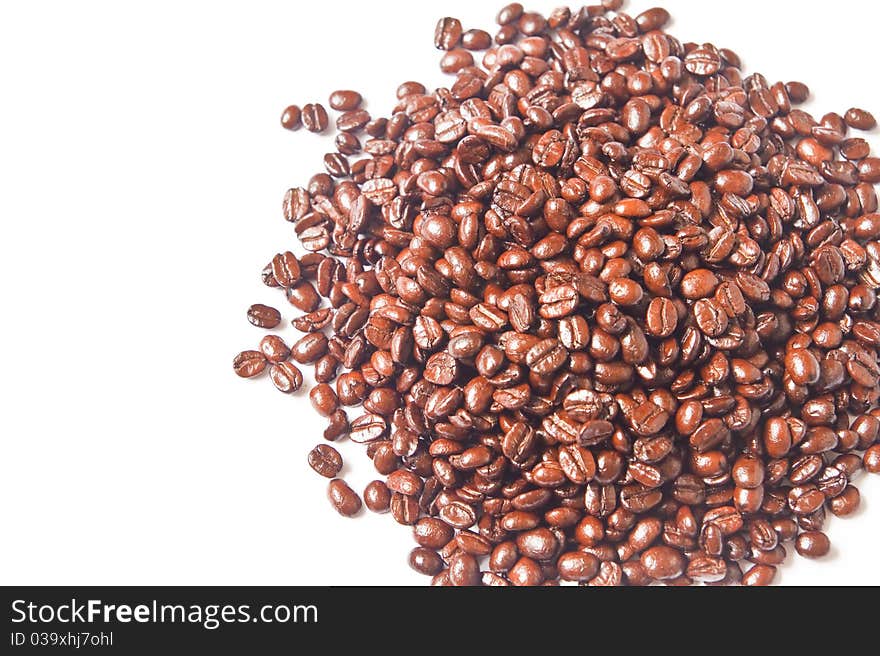 Many brown coffee beans on white background. Many brown coffee beans on white background