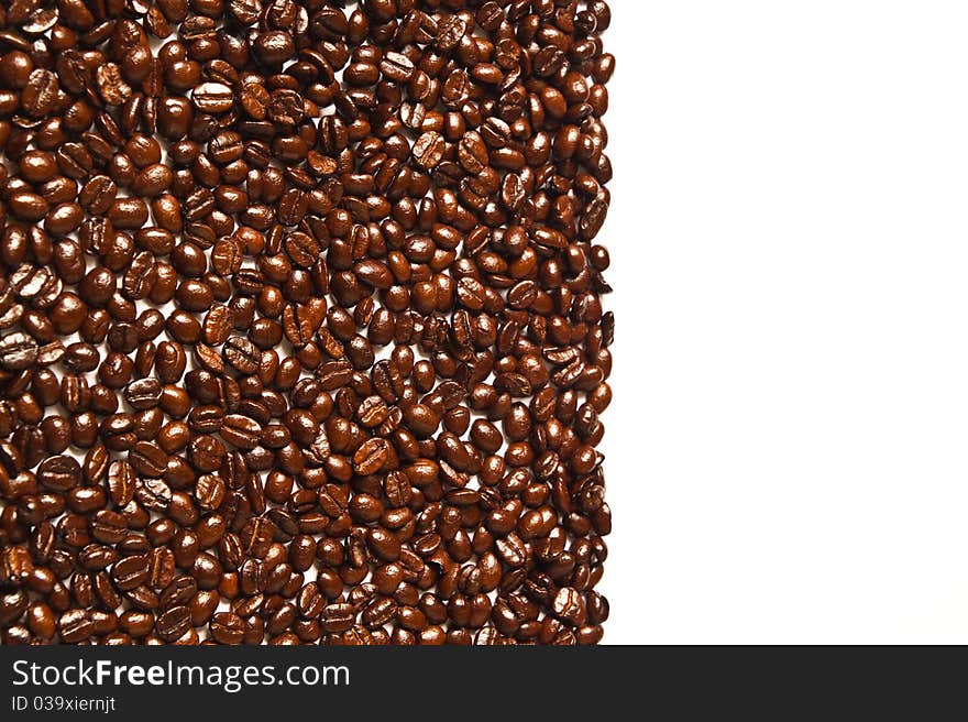 Many brown coffee beans on white background. Many brown coffee beans on white background