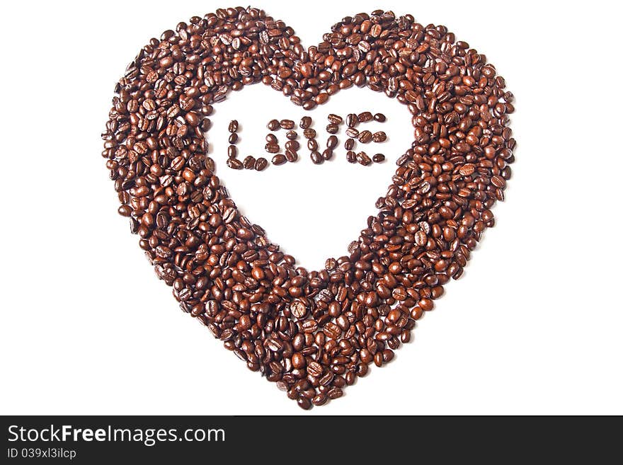 Heart from brown coffee beans and word of love