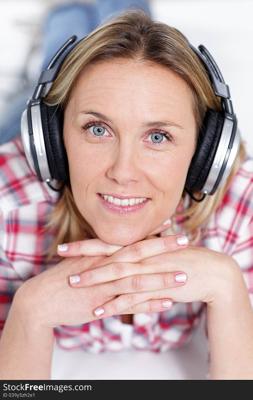 Beautiful blond woman listening music. Beautiful blond woman listening music