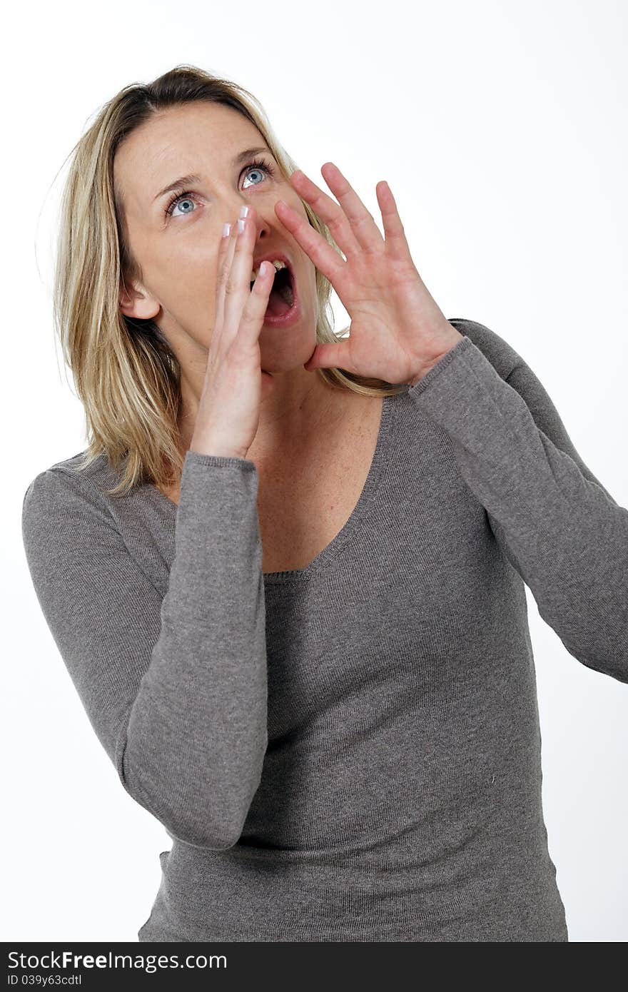 Blond woman crying in studio