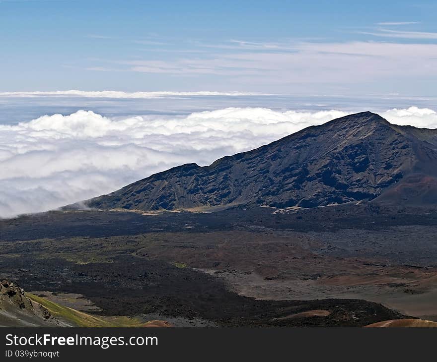 Clouds roll into Haleakala volcano in Maui, Hawaii, USA. Clouds roll into Haleakala volcano in Maui, Hawaii, USA