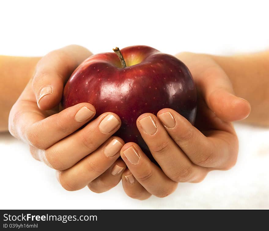 Fresh red apple in a woman hand