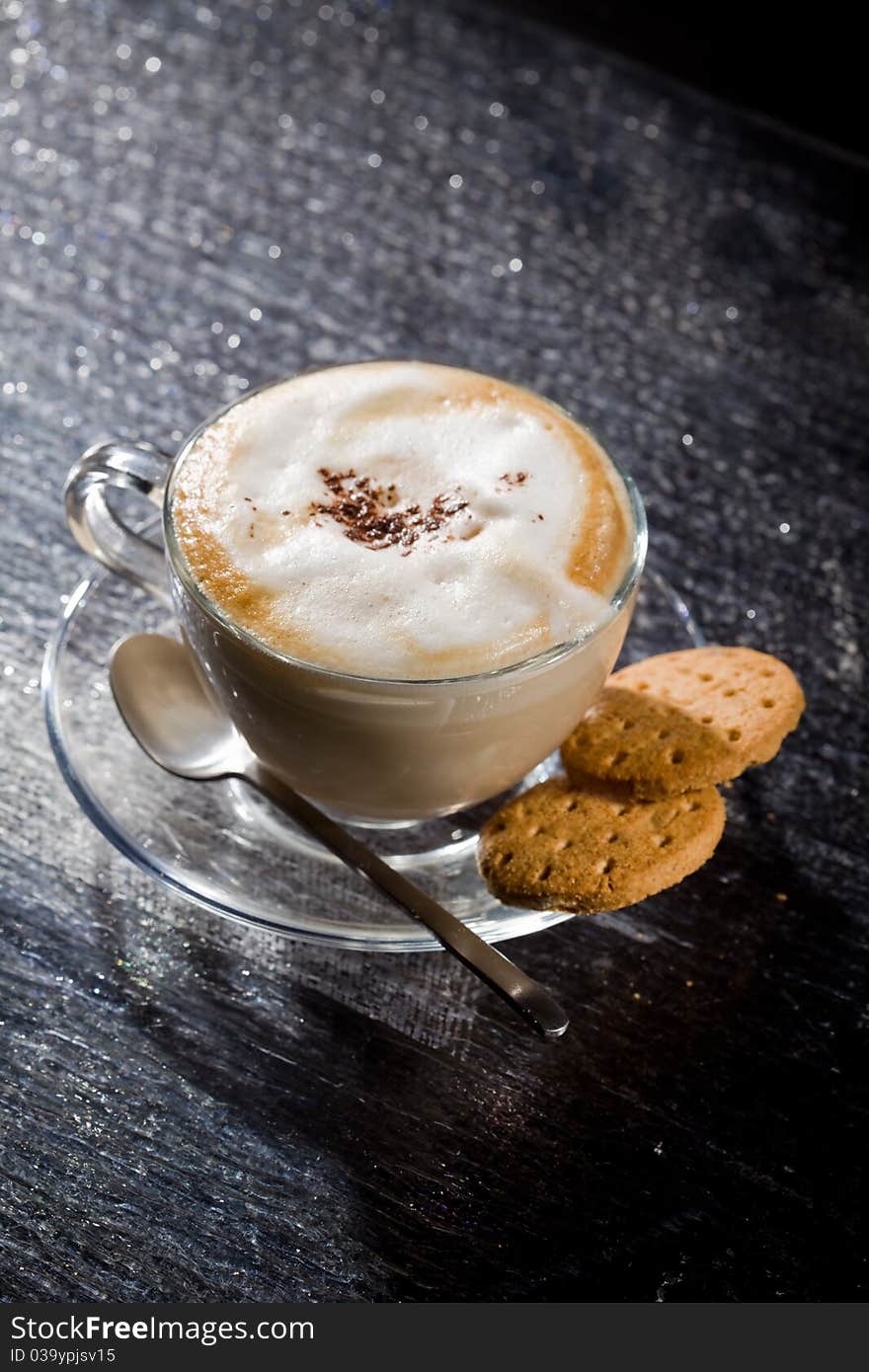 Cappuccino on black glass table