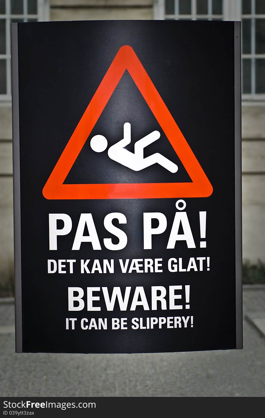 Beware sign. It can be slippery outside on the street. Sign from Denmark.