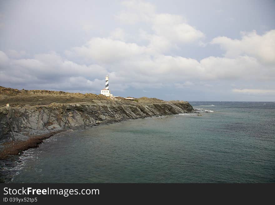 Lighthouse of Favaritx Cape at Menorca island in Spain. Lighthouse of Favaritx Cape at Menorca island in Spain