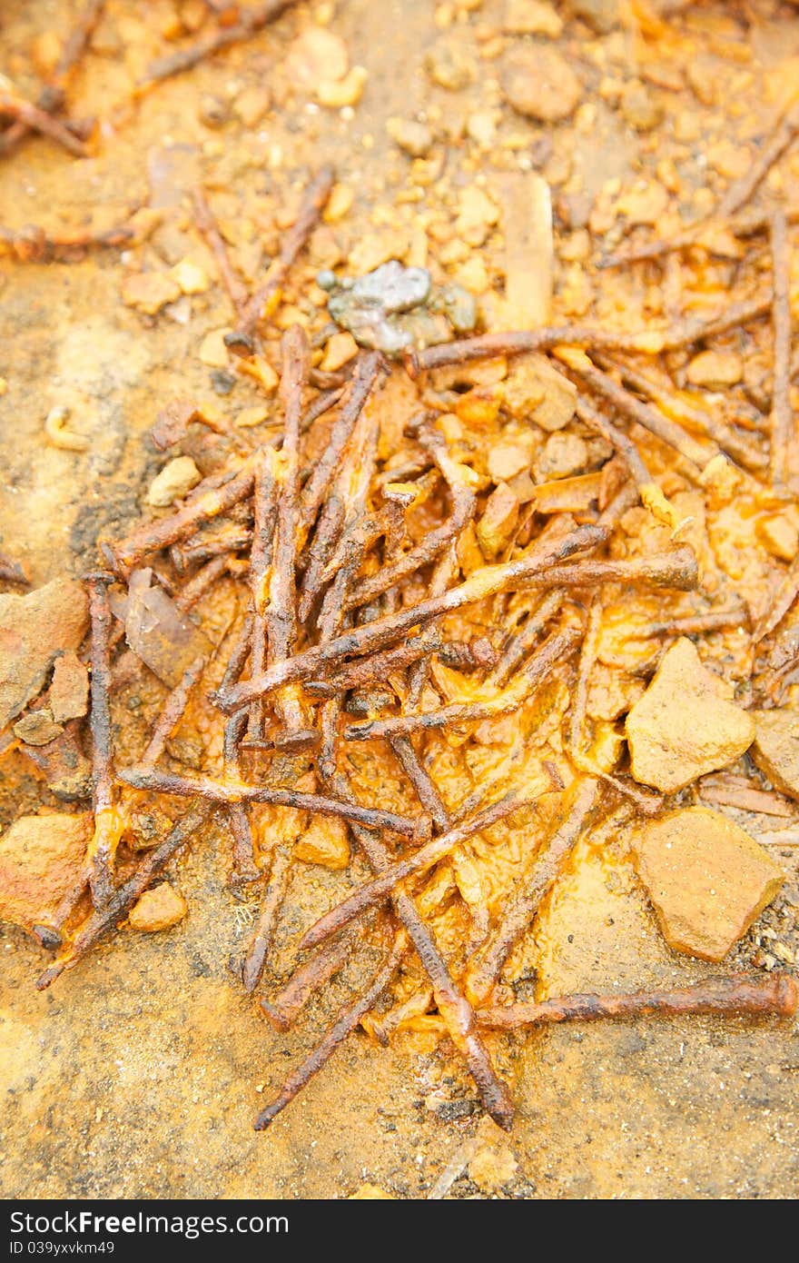 Group of rust nails on puddle. Group of rust nails on puddle