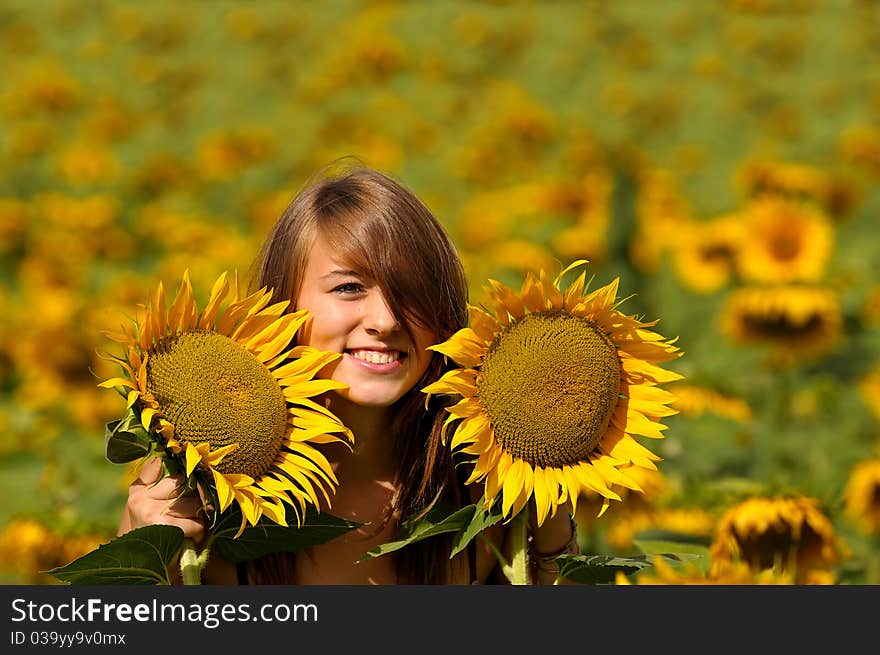 A young woman blossomed into sunflower. A young woman blossomed into sunflower