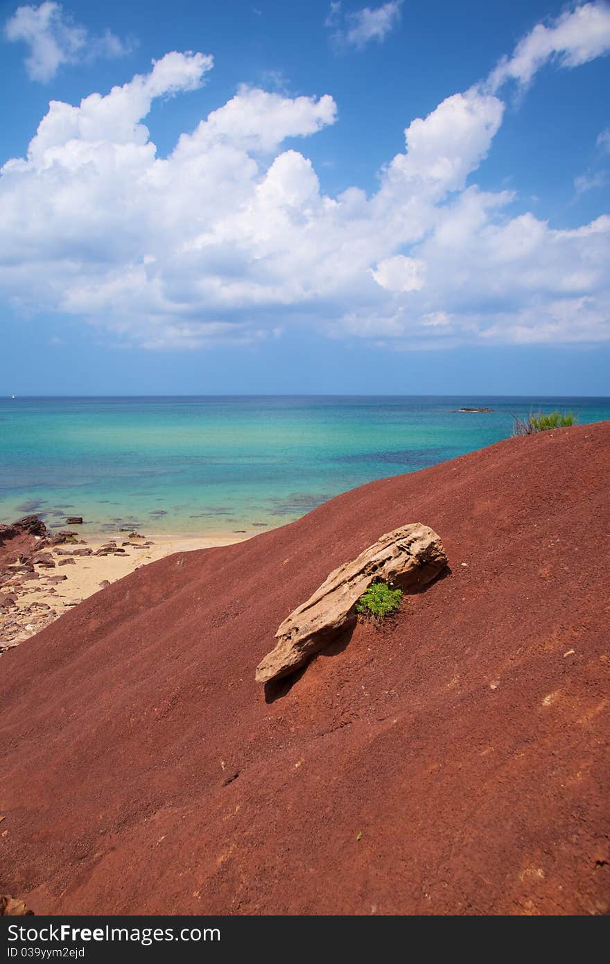 Ocean and rock on red earth