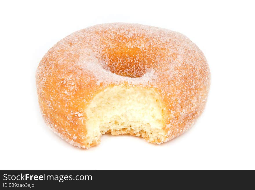 Sugar Ring Donut With Bite Missing On White