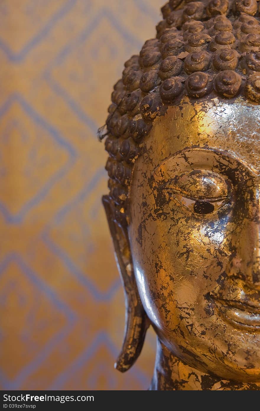 Half of Buddha face Close-up statue at Angthong province,Thailand. Half of Buddha face Close-up statue at Angthong province,Thailand.