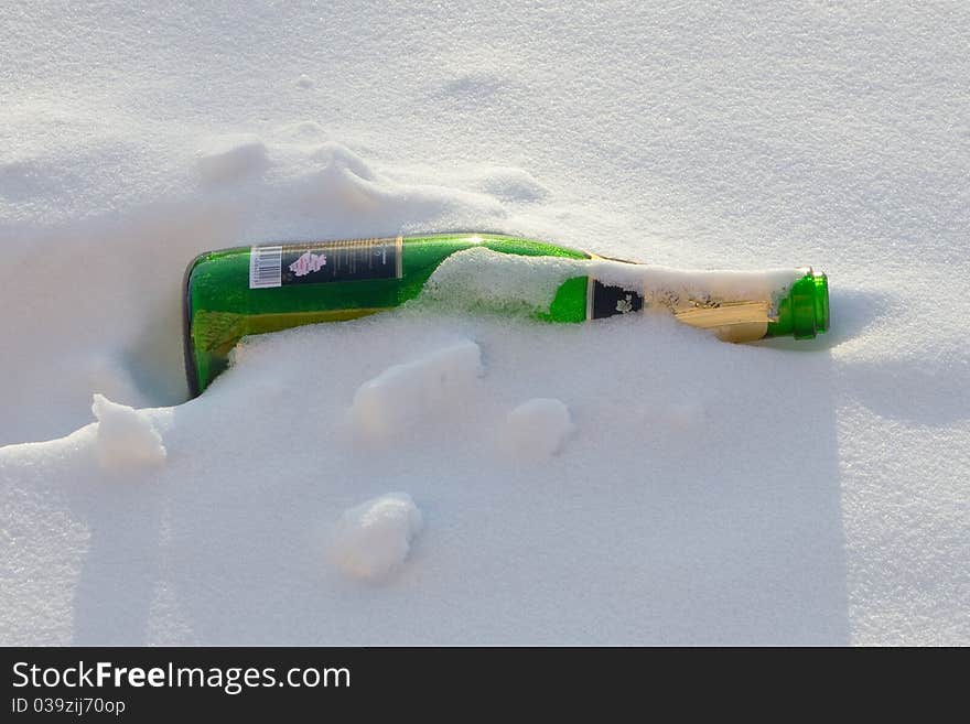 Bottles of sparkling wine in the snow. Bottles of sparkling wine in the snow.