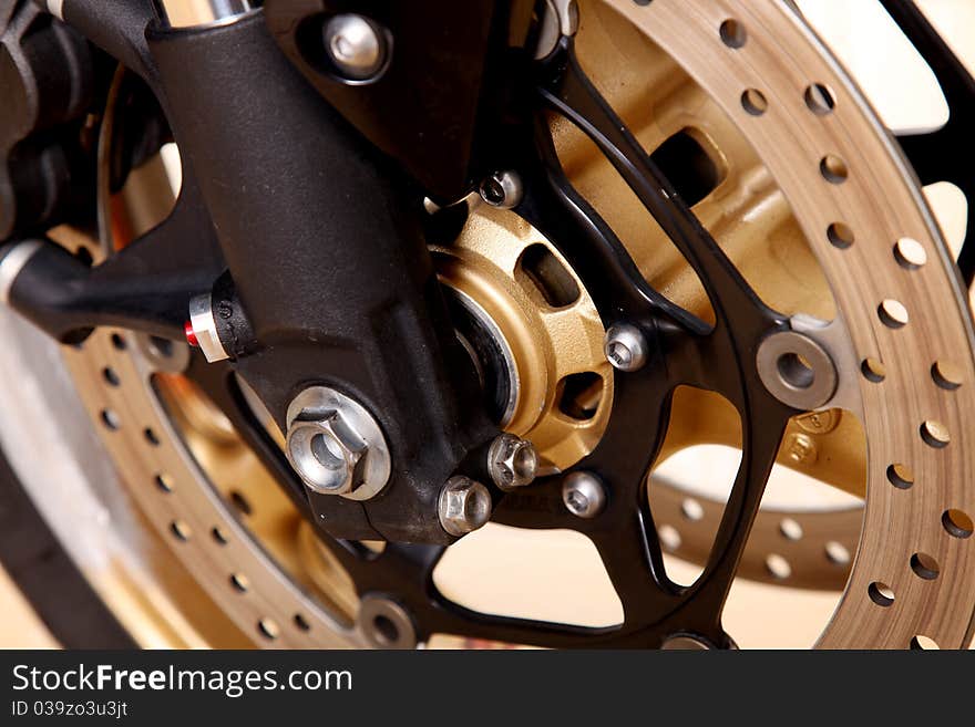 Golden and black tire radius close up. Background