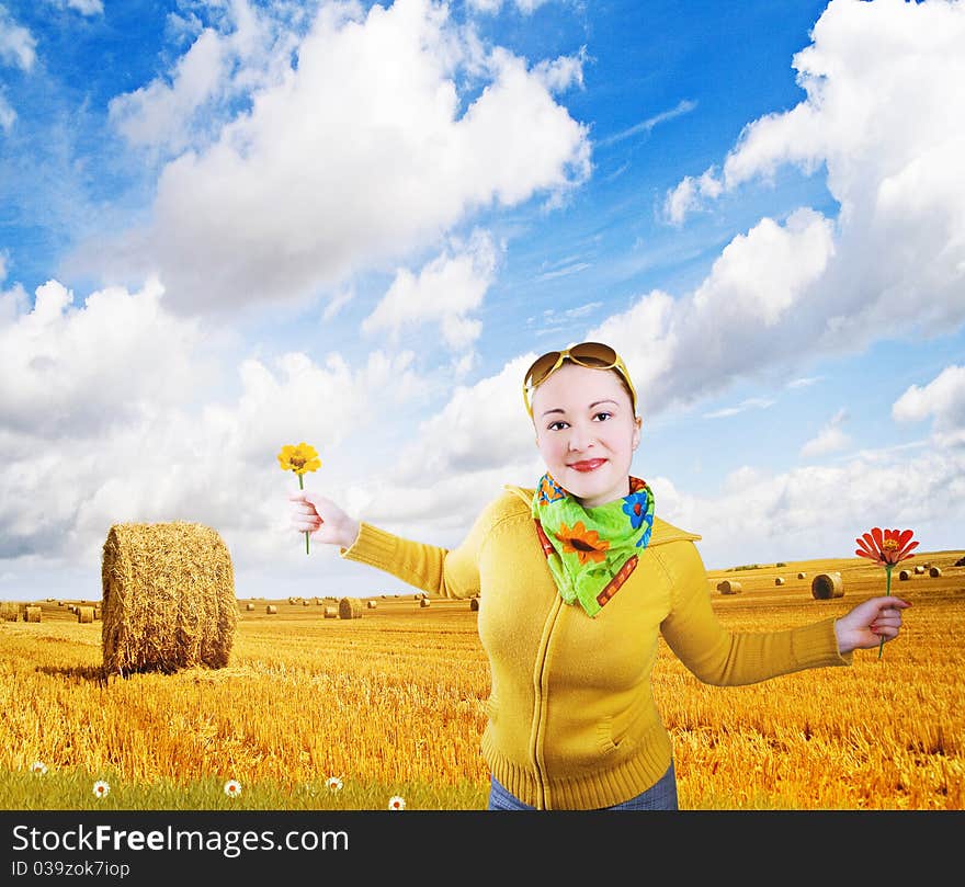 girl and autumn landscape: grain field and cloudy blue sky. girl and autumn landscape: grain field and cloudy blue sky