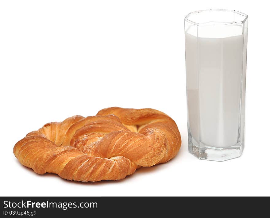 Breakfast glass of milk and bread isolated on white