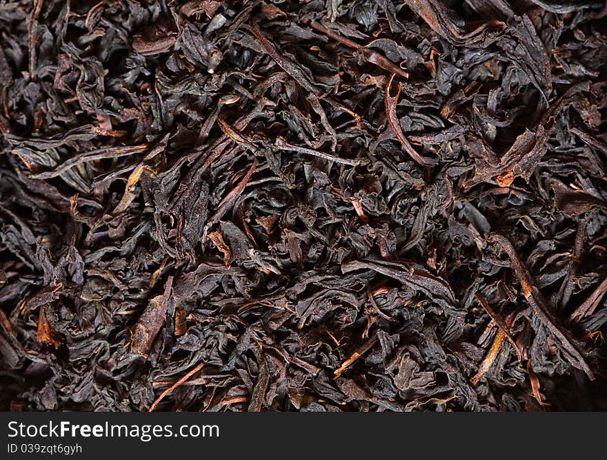 Scattering black tea. Macro. Color image.