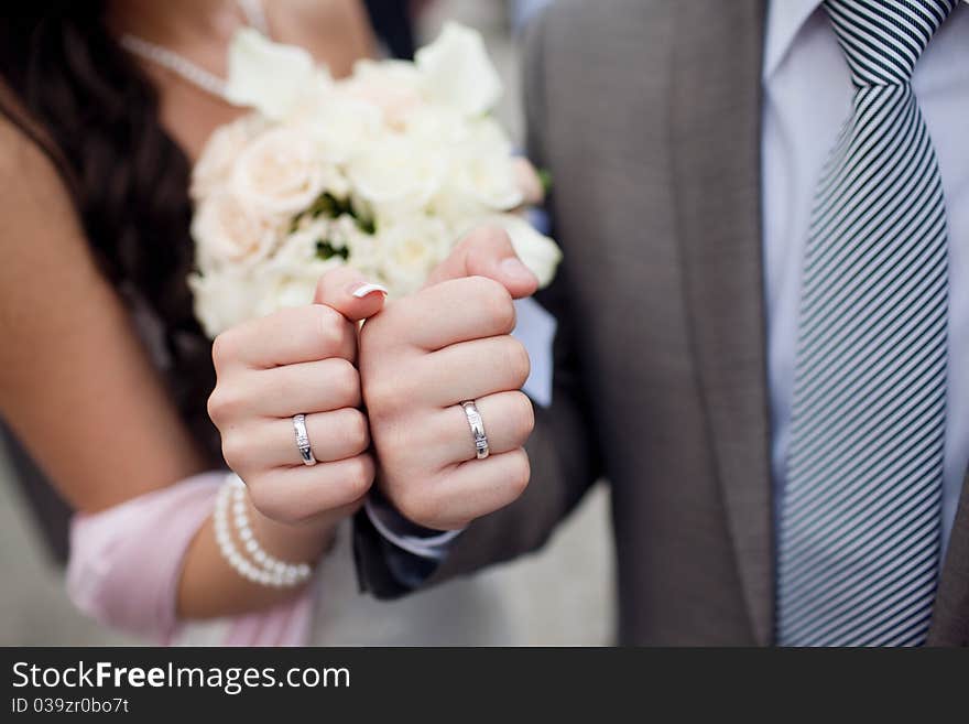 Fists of bride and groom. Fists of bride and groom