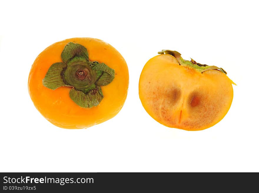 Persimmon And A Sliced Section Showing the Seeds Within. Fruit Is Isolated on White Background