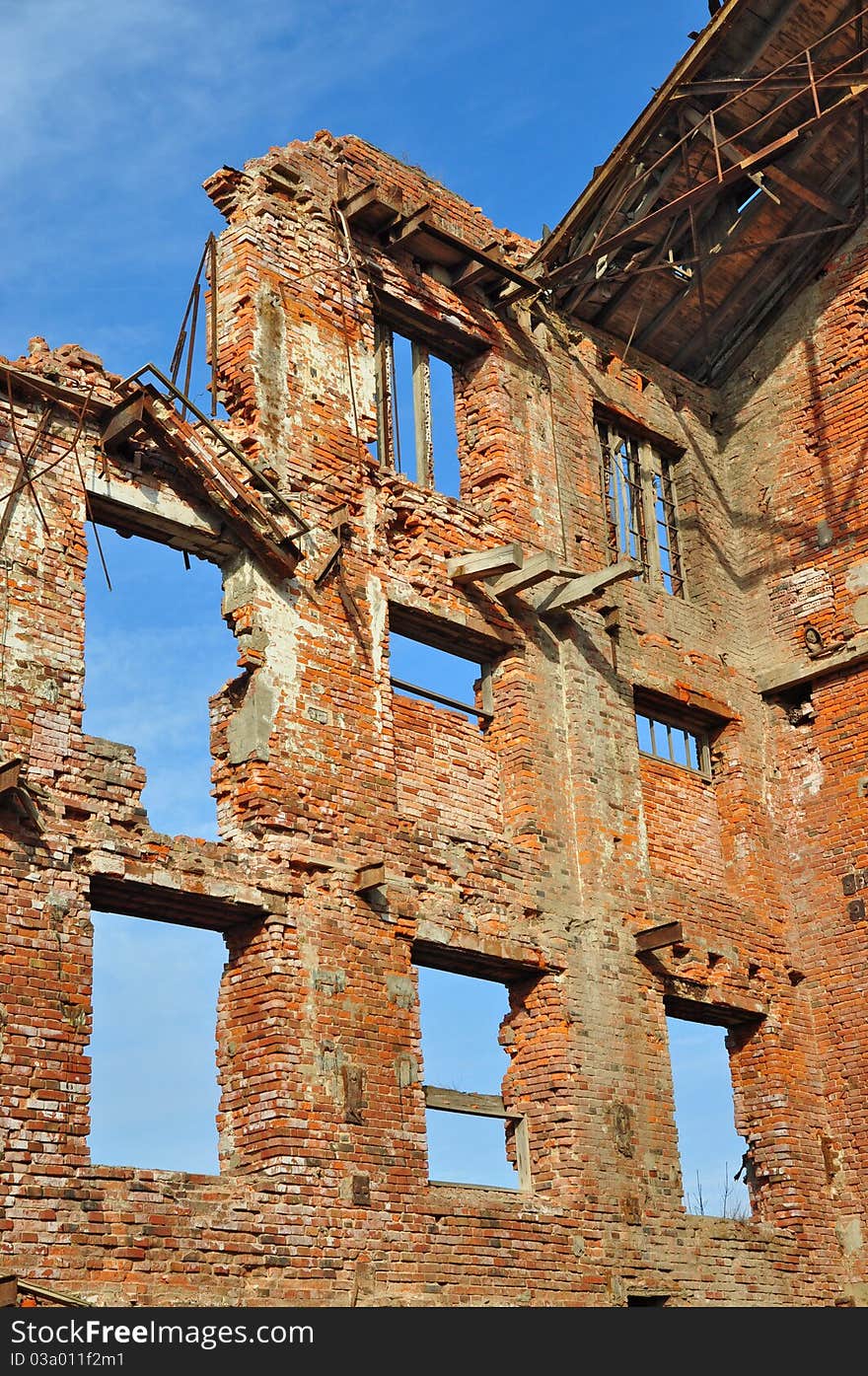 Ruins of an old industrial building against the sky