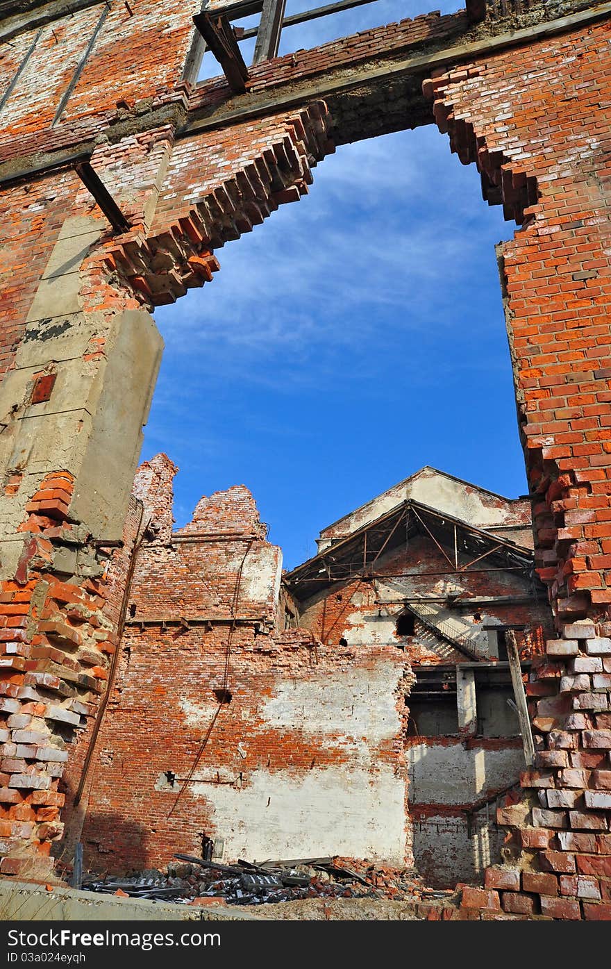 Ruins of an old industrial building against the sky