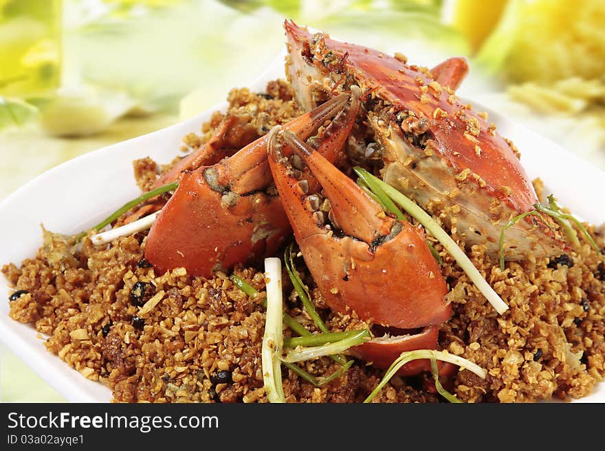 An Chinese fried crab on white dish