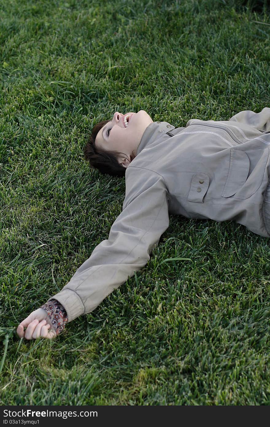 Girl lying on green grass. Girl lying on green grass