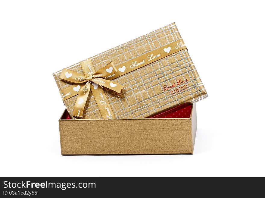 Gold striped present box isolated on white background