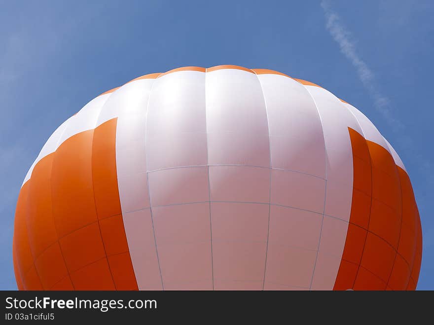 Top of a hot air balloon isolated on blue. Top of a hot air balloon isolated on blue